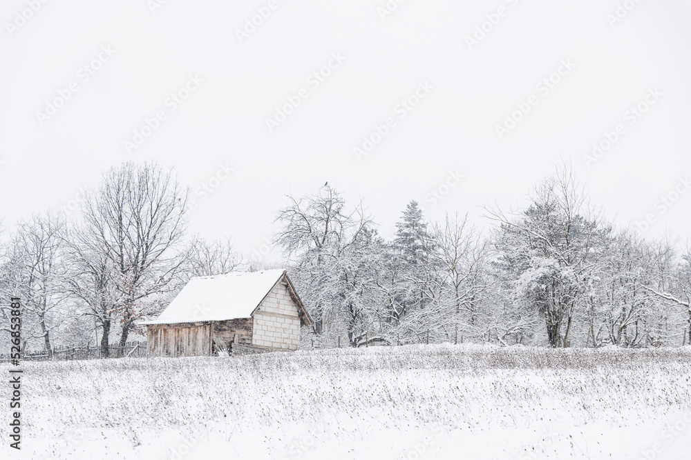 An old country house on a snow-covered hill