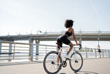 Cyclist woman rides a road bike fitness training, eco transport