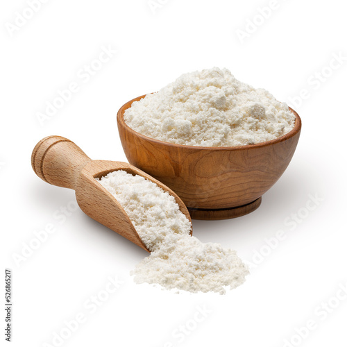 Wooden bowl and scoop full of coconut flour isolated on white background