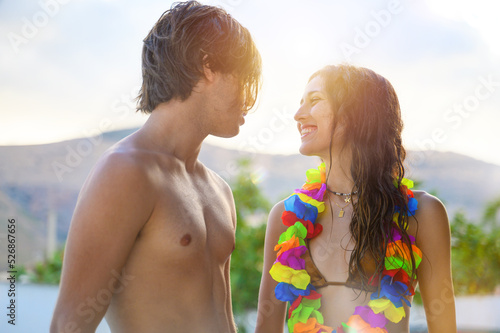 Happy couple enjoy the summer in a swimming pool