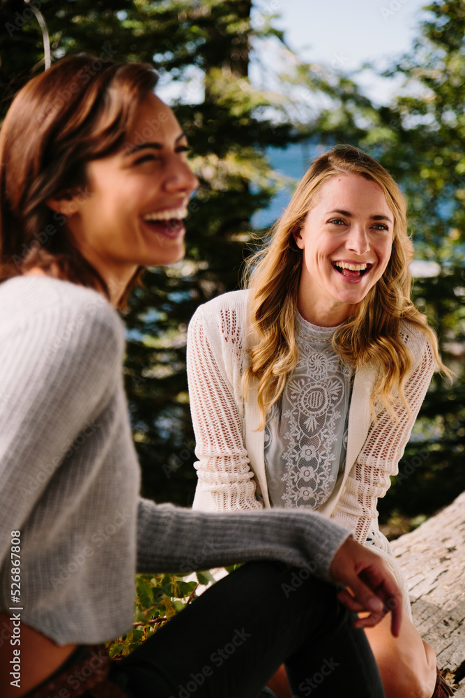 Two friends laugh while enjoying nature Two friends laugh while enjoying nature