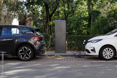 Two e-cars at a charging station