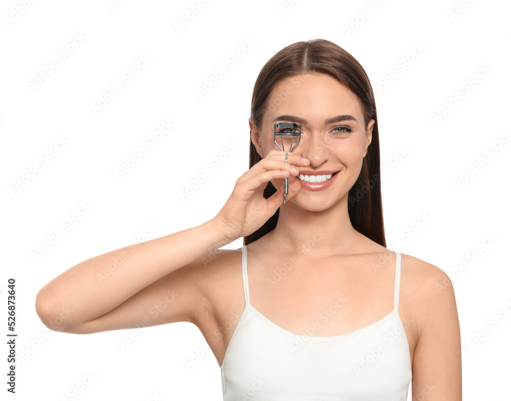 Woman using eyelash curler on white background Woman using eyelash curler on white background