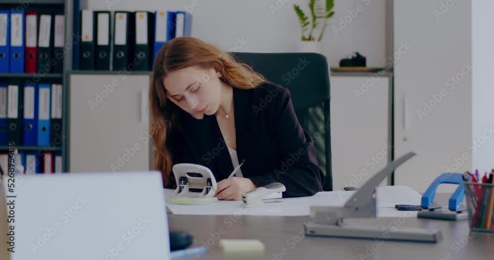 Tensed Businesswoman Working on Laptop in Office Tensed Businesswoman Working on Laptop in Office