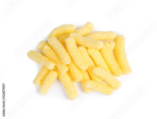 Pile of tasty corn puffs on white background, top view