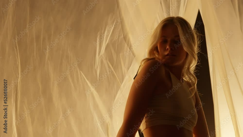 Close-up of Professional Dancer Performing in Studio in Soft Warm Lighting Close-up of Professional Dancer Performing in Studio in Soft Warm Lighting