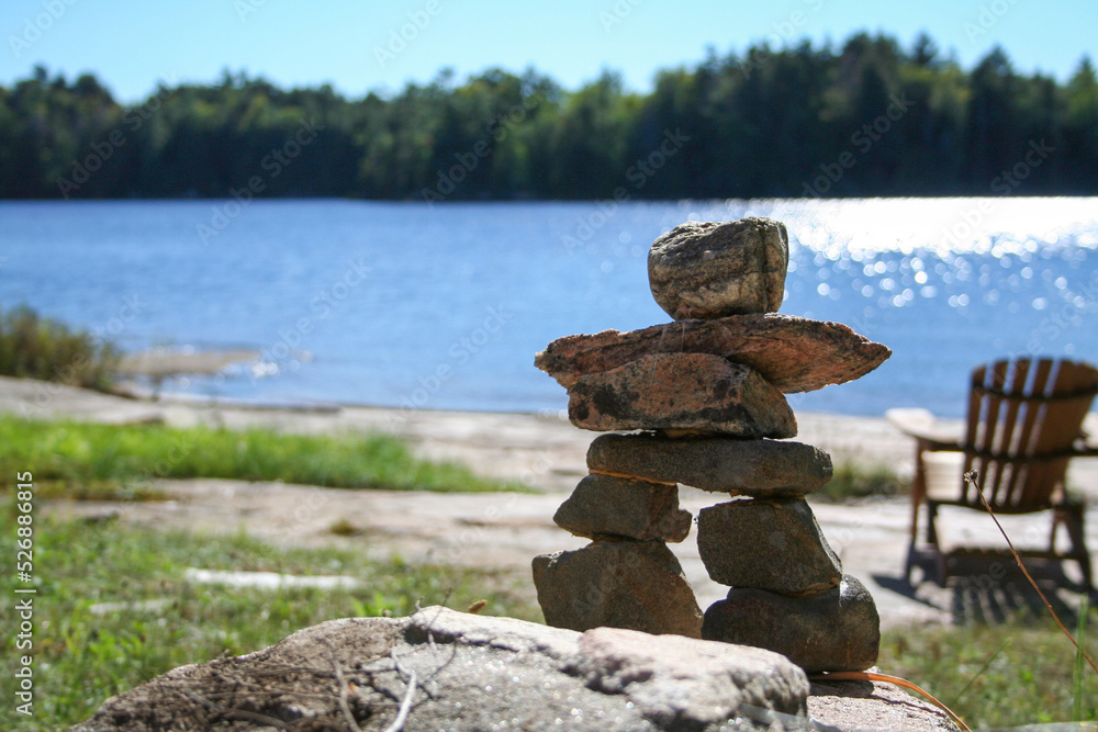 Small inuksuk on a lake shore near Orrville, Ontario.