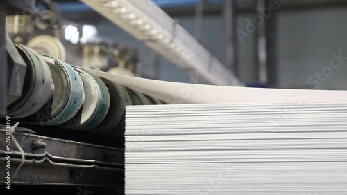 Conveyor line for production plastic sheets for furniture. Roll of galvanized steel sheet. Industrial manufacturing process of plastic Polycarbonate sheet for table and furniture surfaces. 4 k video