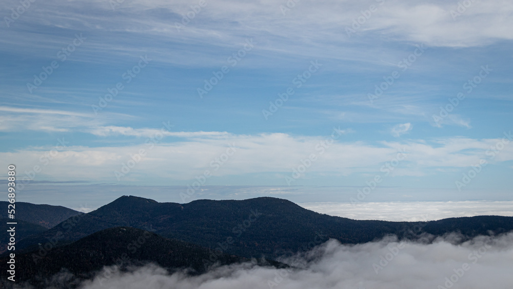Mount Mansfield Vermont peeking out above the clouds