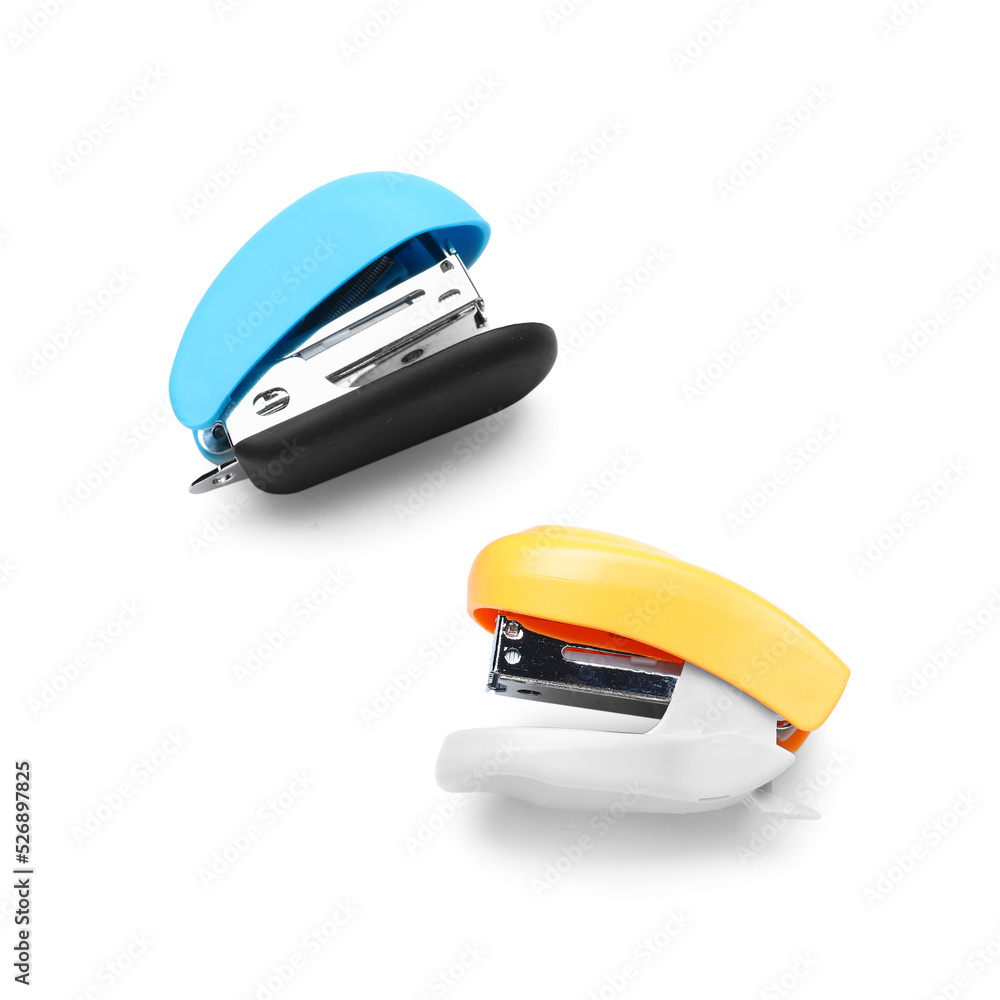 Two colorful staplers isolated on white background Two colorful staplers isolated on white background