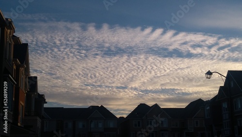 pattern clouds between houses