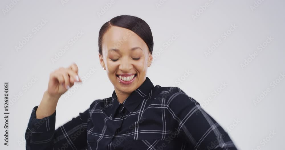 Dance, arm movement and happy woman dancing to a song on the radio in a studio with copy space. Smiling girl dancer having a fun, cheerful and disco music party alone with a gray background. Dance, arm movement and happy woman dancing to a song on the radio in a studio with copy space. Smiling girl dancer having a fun, cheerful and disco music party alone with a gray background.