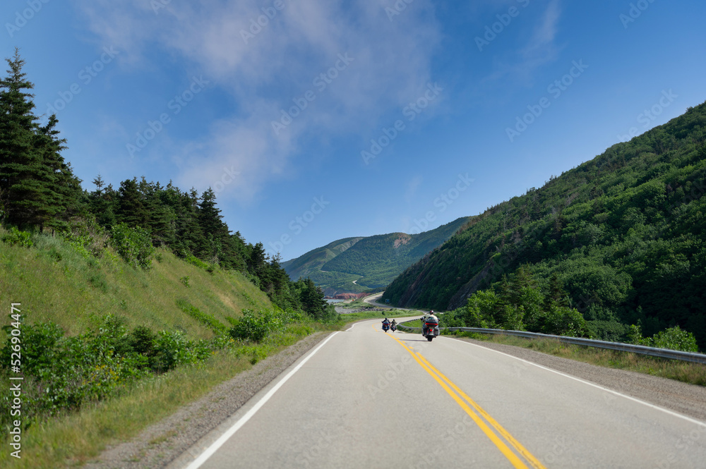 Motorcycles riding on the Cabot Trail in Cape Breton Highlands National Park, Nova Scotia, Canada on a summer day Motorcycles riding on the Cabot Trail in Cape Breton Highlands National Park, Nova Scotia, Canada on a summer day