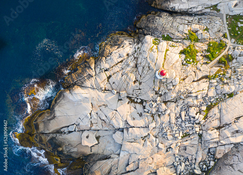 Aerial view of Peggy's Cove rock at sunrise. The lighthouse is visible. Nova Scotia, Canada photo