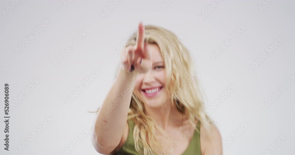 Woman dancing, moving and doing happy dance against a grey mockup studio background. Mock up portrait of a dancer, girl and person being crazy, being comic and funny for happiness and comedy Woman dancing, moving and doing happy dance against a grey mockup studio background. Mock up portrait of a dancer, girl and person being crazy, being comic and funny for happiness and comedy