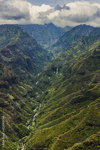 Winding river below the mountain ranges of Kauai, Hawaii.