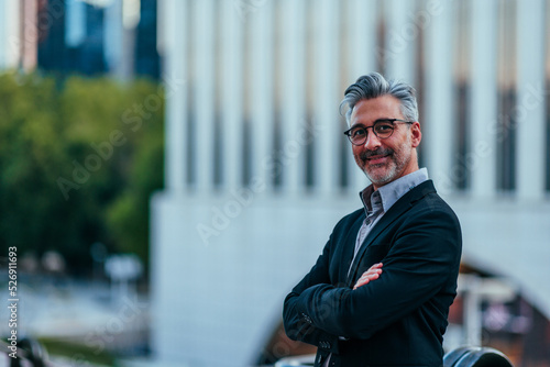 Confident manager posing in city photo