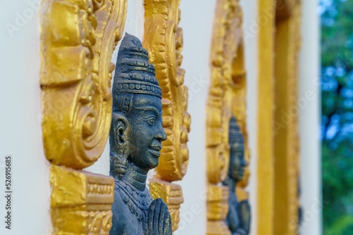 Fotografie Closeup of statues at a temple in Takeo province, Cambodia