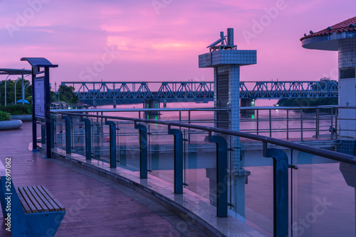 Night view of Shilong South Bank Park in Dongguan, China. Dongguan Cityscape. Pink purple sunset in the evening sky. photo