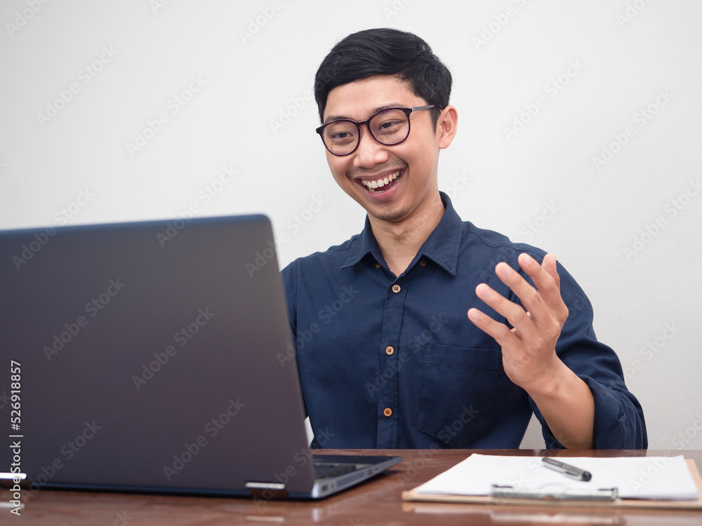 Positive businessman wear glasses happy with working using laptop at workplace table Positive businessman wear glasses happy with working using laptop at workplace table