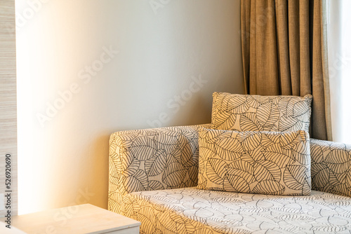 Fototapeta Naklejka Na Ścianę i Meble -  pillow on sofa near window