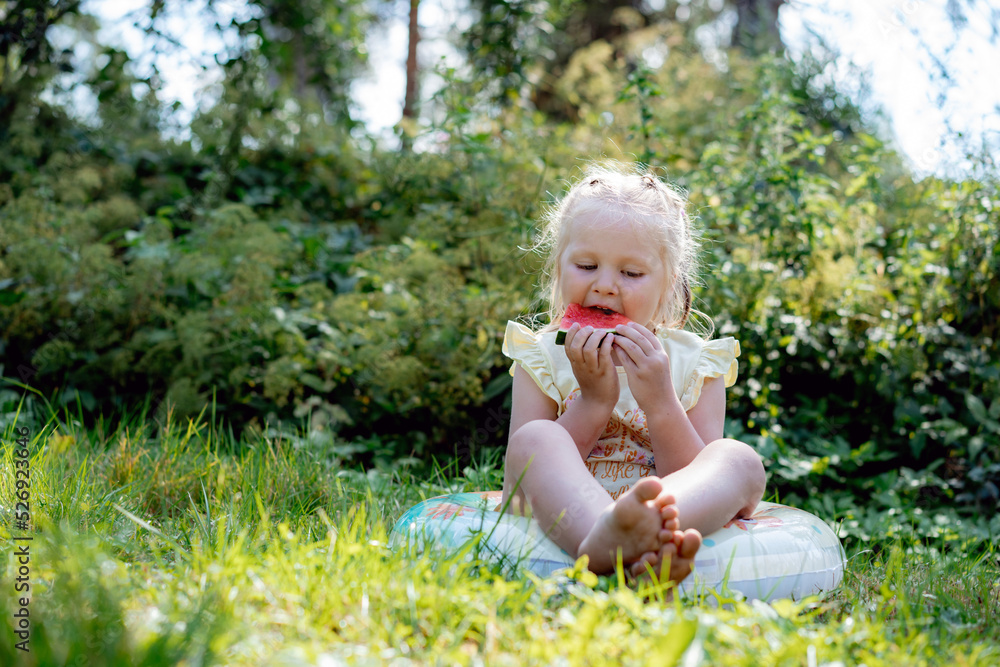 cute caucasian girl eating watermelon in countryside cute caucasian girl eating watermelon in countryside