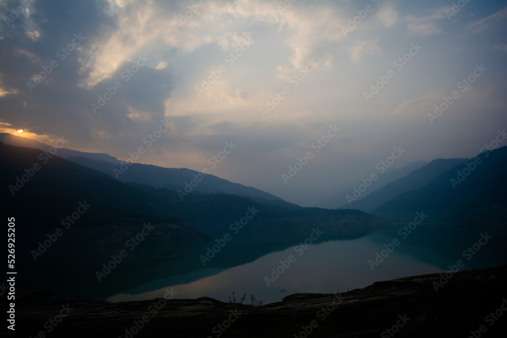 Sunrise view of Tehri mountains. Scenery sunrise over Tehri Lake, Uttarakhand. Tehri Dam, the tallest dam in India and Tehri dam is Asia's largest man-made lake.