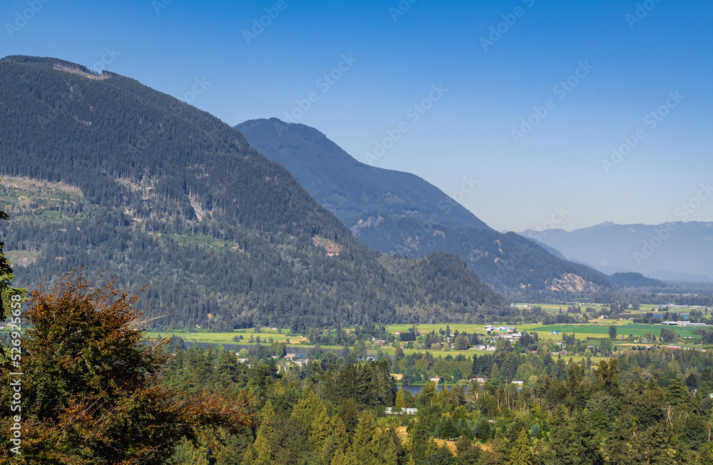 View of the Fraser Valley near Abbotsford BC. Summer in the Fraser Valley. Canadian homestead. Rural agricultural land