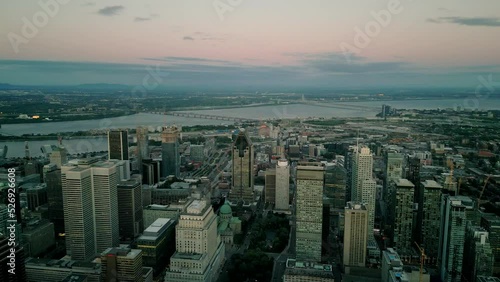 Wallpaper Mural 4K Cinematic urban drone footage of an aerial view of buildings and skyscrapers in the middle of downtown Montreal, Quebec during a beautiful sunset by Mont Royal. Torontodigital.ca