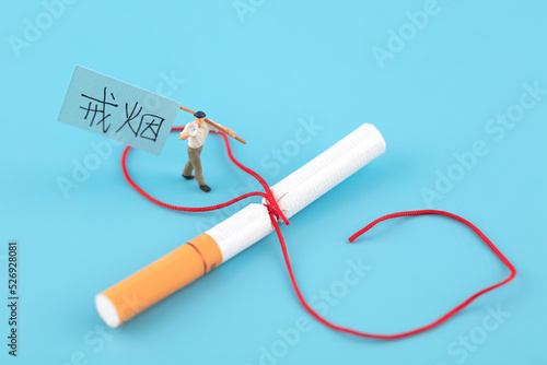 Man in miniature who decides to quit smoking