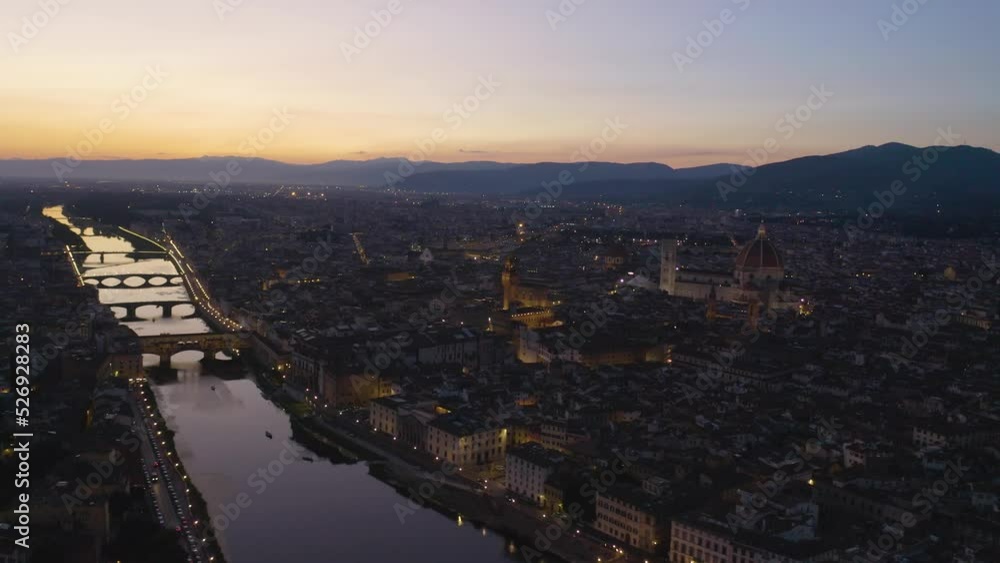 Drone Backward Moving Shot Over Florence, Italy at Sunset. Colorful Sky