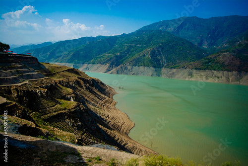 Tehri lake surrounded by mountains in Uttarakhand, india, Tehri Lake is an artificial dam reservoir. Tehri Dam, the tallest dam in India and Tehri dam is Asia's largest man-made lake.