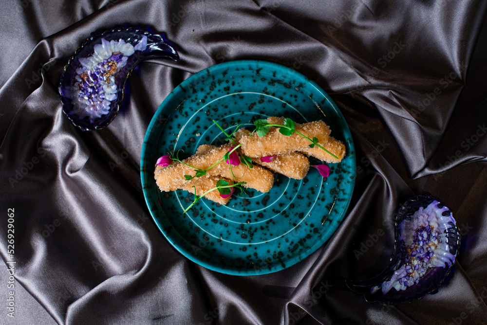 Fototapeta premium Cheese sticks with red sauce