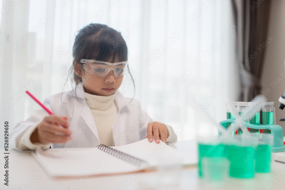 education, science, chemistry, and children concept - kids or students with test tube making experiment at school laboratory education, science, chemistry, and children concept - kids or students with test tube making experiment at school laboratory