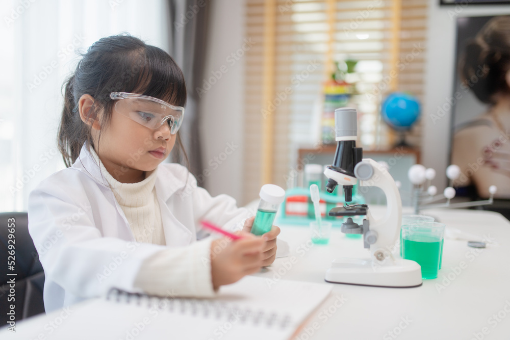 education, science, chemistry, and children concept - kids or students with test tube making experiment at school laboratory education, science, chemistry, and children concept - kids or students with test tube making experiment at school laboratory