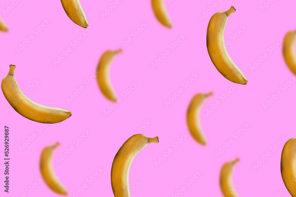 pink background with flying bananas