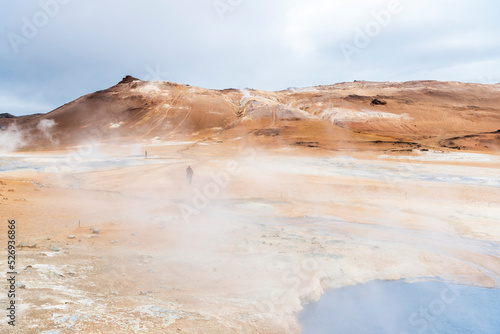 Namafjall, geothermal area in Hverir Hverarönd with tourists strolling. Boiling mud pools and hot springs. Tourist and natural attractions in Iceland Iceland, Europe