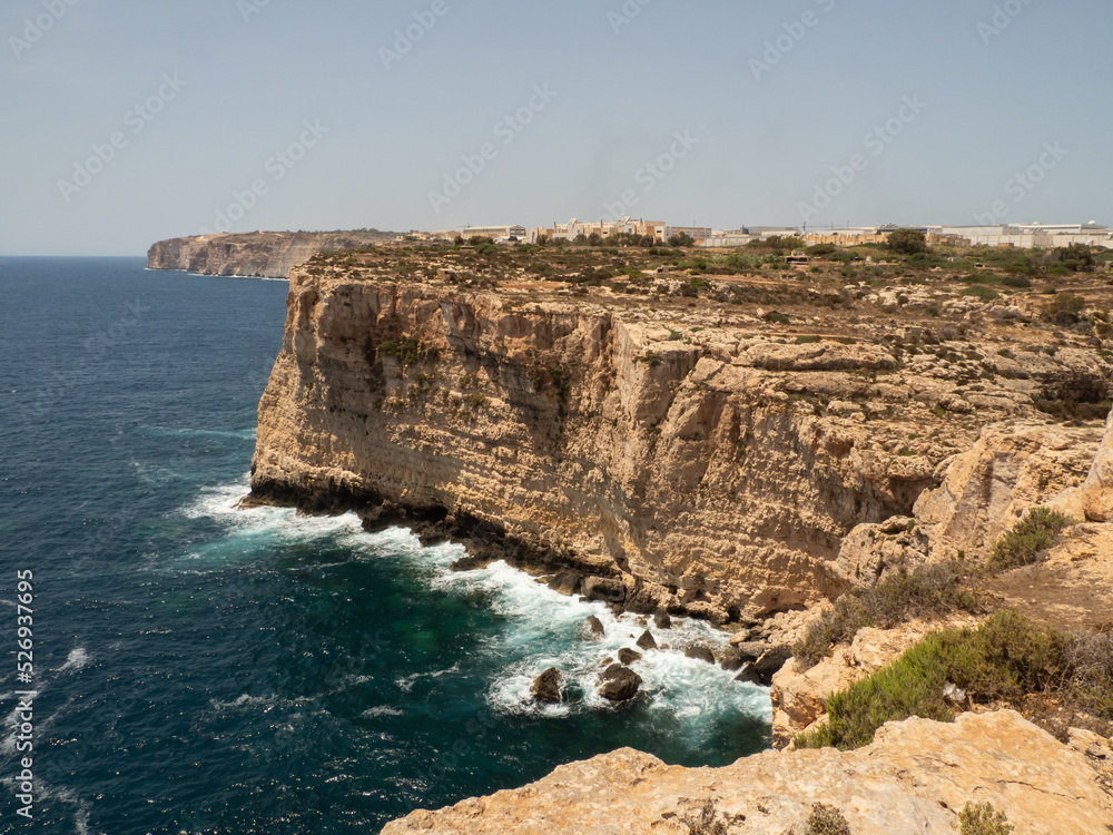 Rocky coast near Ghar Hasan Cave, Malta, Europe. Rocky coast near Ghar Hasan Cave, Malta, Europe.