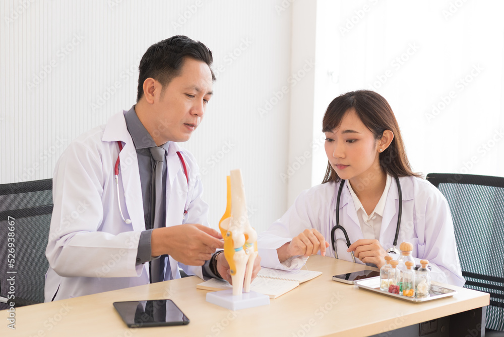 Group of Asian doctor meeting and discuss with other colleagues in modern office clinic room. Group of Asian doctor meeting and discuss with other colleagues in modern office clinic room.