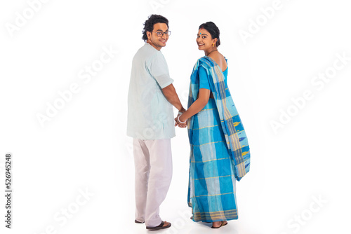 Wallpaper Mural Portrait of Bengali couple looking back at camera against white background Torontodigital.ca