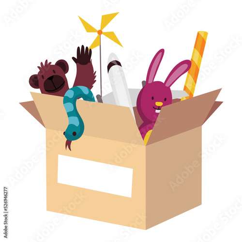 Cardboard donation box full of toys and devices. Charity and donate for poor people, help homeless and support needy. Volunteering, social care charity concept. Needed items