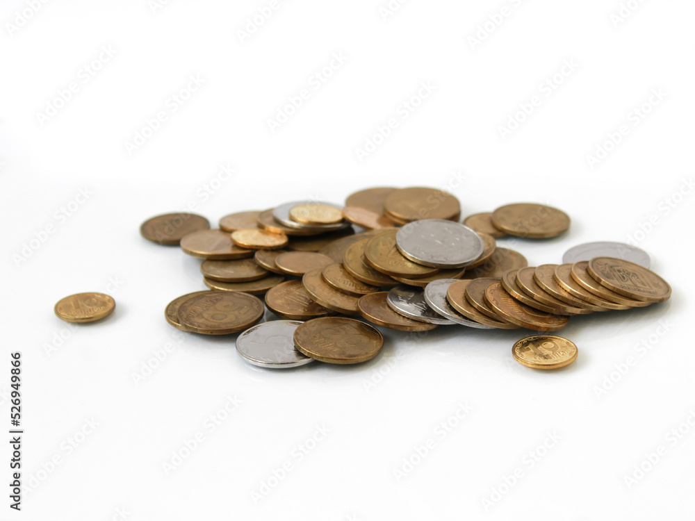 Closeup ukrainian silver and golden coins - hryvnia on a white background using as business and financial concept Closeup ukrainian silver and golden coins - hryvnia on a white background using as business and financial concept