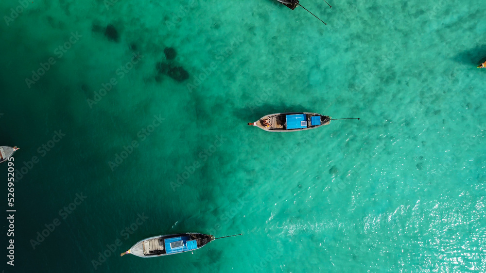 Photo in paradise island. Aerial photography of a boat in crystal clear waters. Phi Phi Island in Thailand. Paradise Beach. drone photography