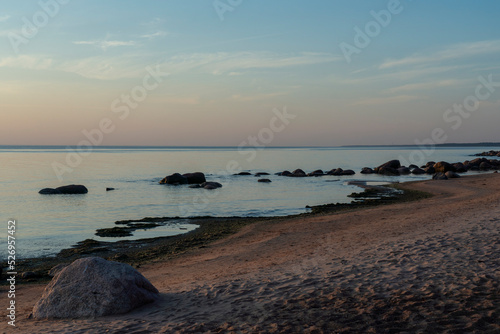 Fototapeta Naklejka Na Ścianę i Meble -  Sunset over the calm Baltic Sea, Tuja, Latvia.