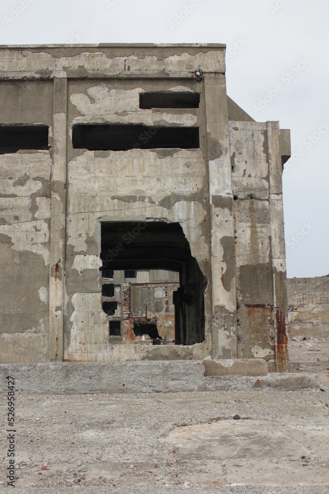 Closeup of destroyed buildings. Hashima Island old coal mines.