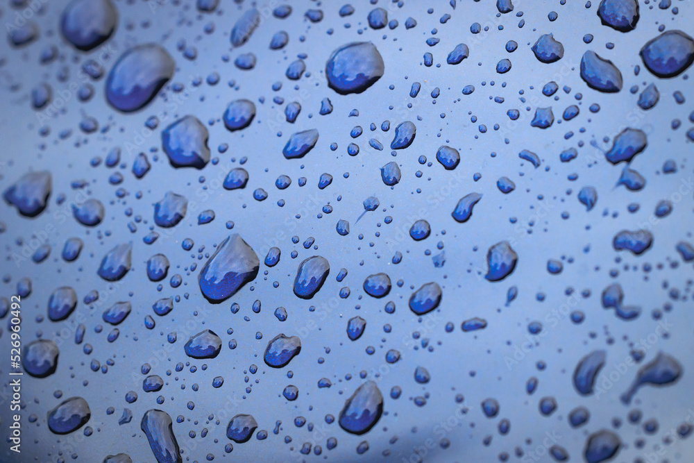 Close up on a raindrops on car body surface Close up on a raindrops on car body surface