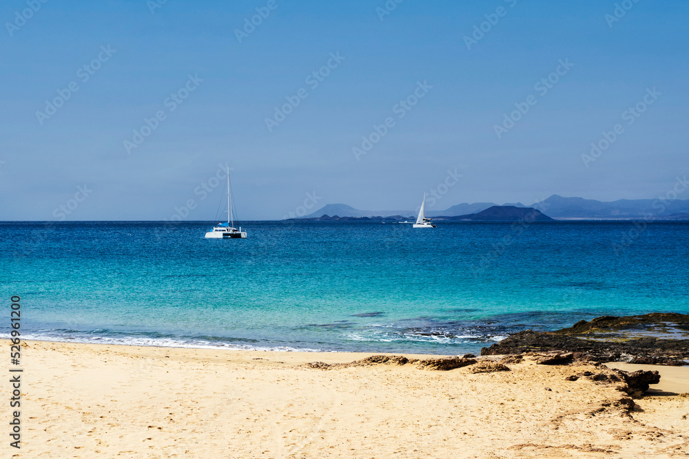 Sailing boat and beach called Playa del Pozo in Los Ajaches National Park on Lanzarote, Canary Islands, Spain