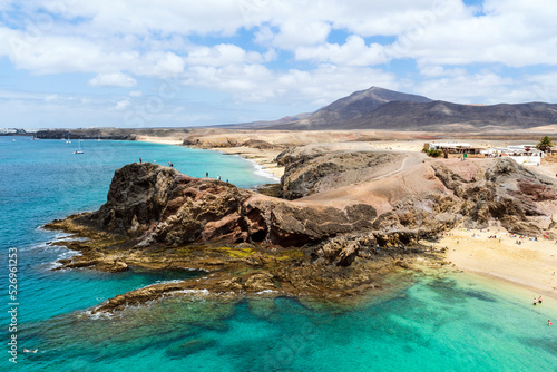 Beautiful Papagayo Beach with white sand and black rocks on Lanzarote, Canary Islands, Spain photo