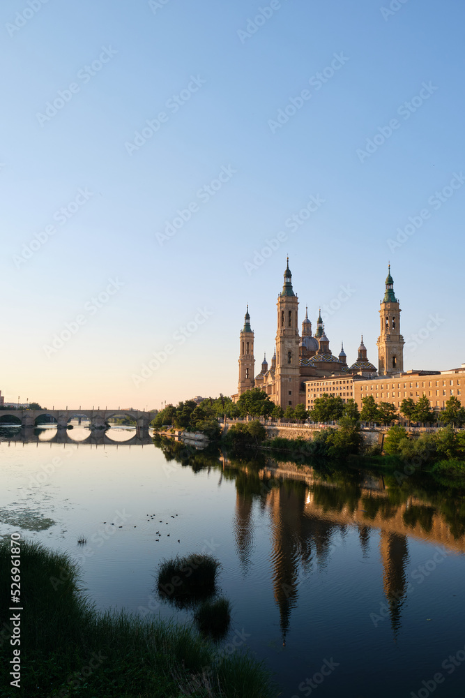 Basilica of Our Lady of the Pillar and Ebro river at sunrise in Zaragoza, Spain. El Pilar de Zaragoza.