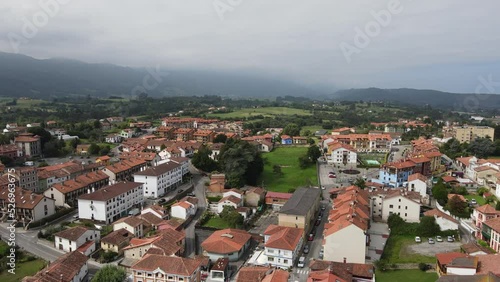Beautiful drone perspective of Colombres in Asturias with red rooftops and the beautiful countryside photo